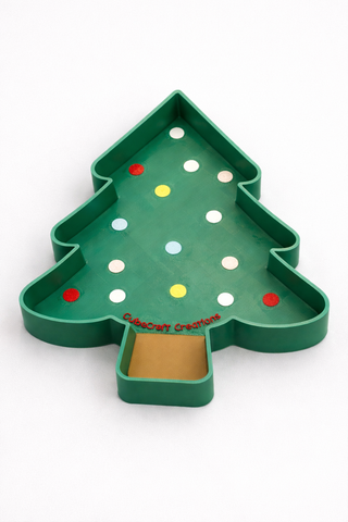 Christmas tree-shaped tray with colorful buttons on a white background
