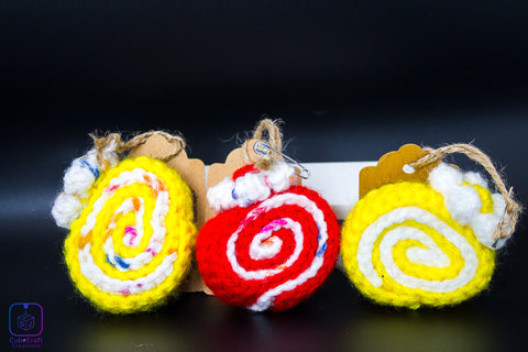 Three colorful spiral-shaped toys with tags on a dark background