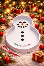 Snowman-shaped tray with 'CubeCraft Creations' on a festive background with Christmas decorations.