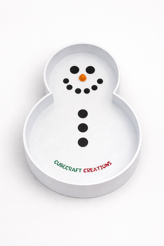 Snowman-shaped tray with black dots for facial features and 'Cubecraft Creations' text on a white background