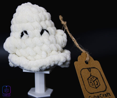 White fluffy creature on a stand with a 'CubeCraft' tag against a dark background