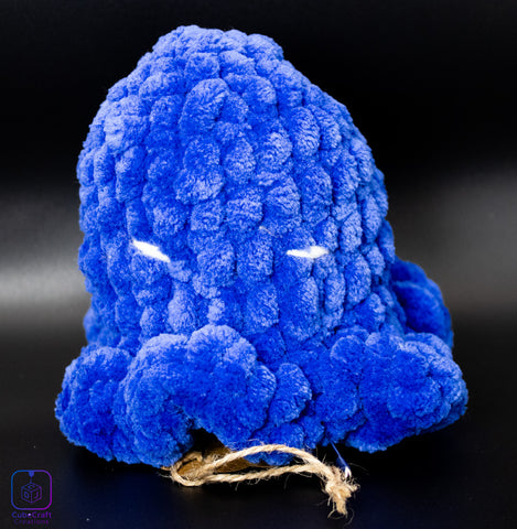 Blue plush toy resembling an octopus on a black background