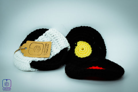 Crocheted record coasters with decorative elements on a light gray background