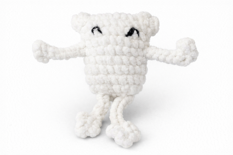 White plush toy with a skeleton design on a white background
